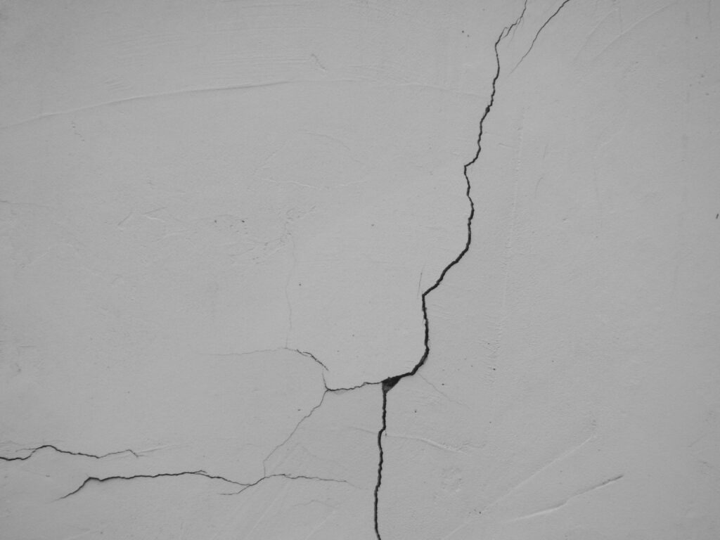 Visible crack running through a white drywall wall