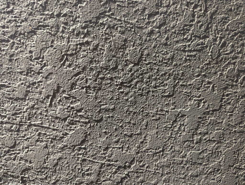 Close-up of drywall texture pattern on wall surface